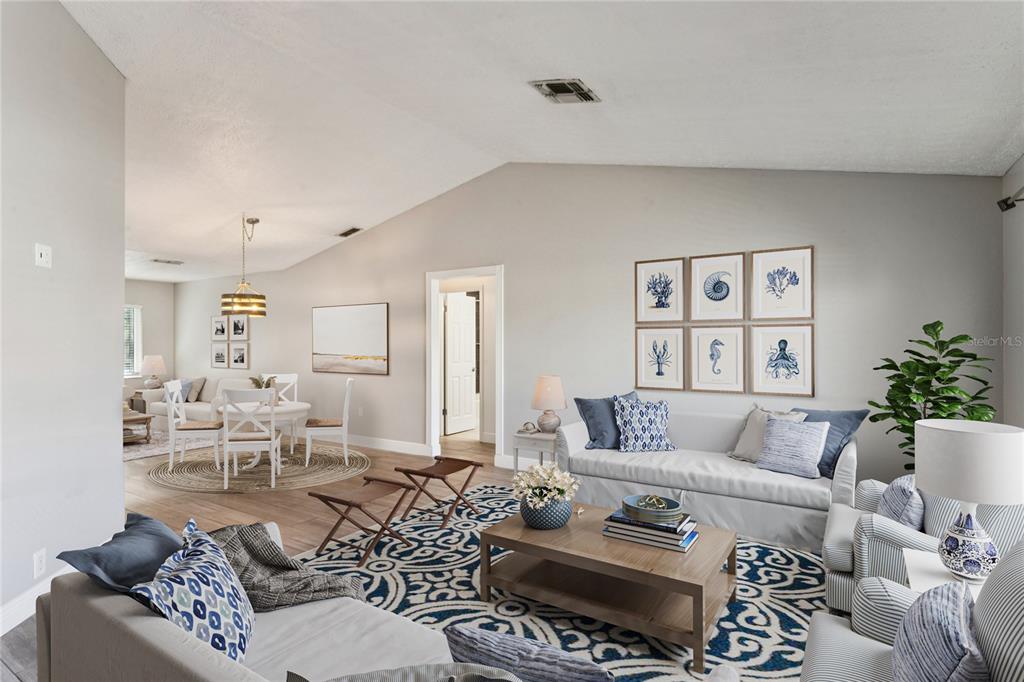 8357 Matthew Drive New Port Richey, FL 34653 - Photo 8 of 78 a living room with furniture potted plant and a window