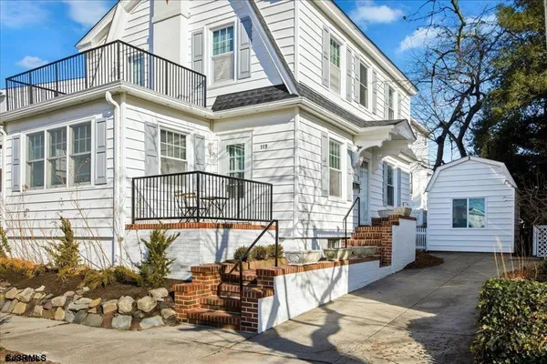 a front view of a house with parking
