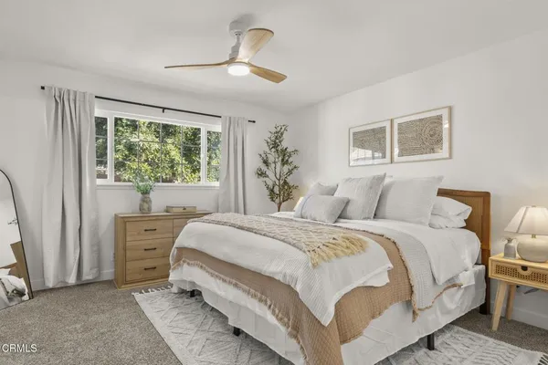 a bedroom with a bed and a bathroom