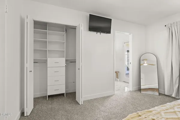 a bathroom with a double vanity sink and mirror