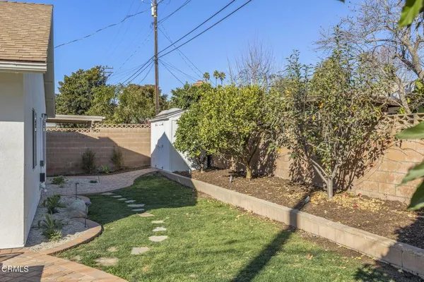 a view of swimming pool with outdoor seating and plants