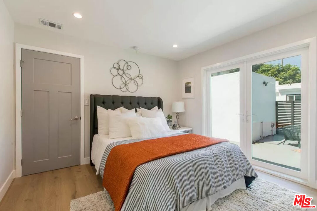 2419 Walnut Avenue Venice, CA 90291 - Photo 10 of 16 a bedroom with a bed and window