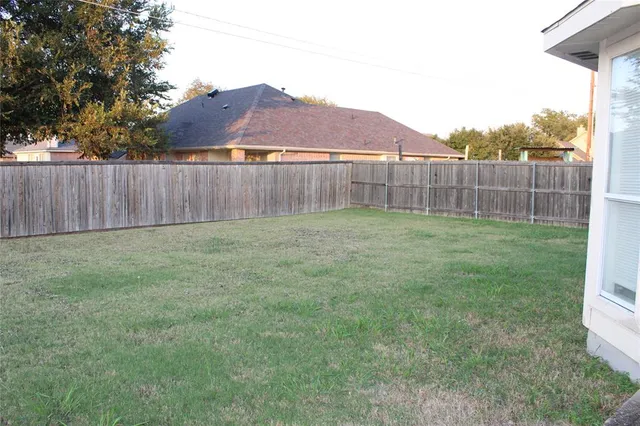 a house with yard in front of it
