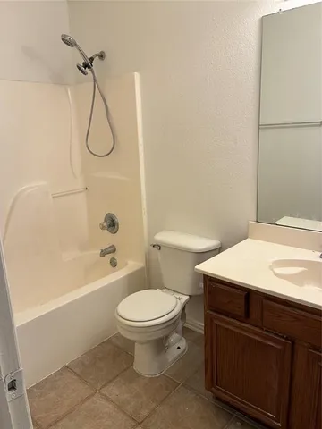 a bathroom with a sink a toilet and a bathtub