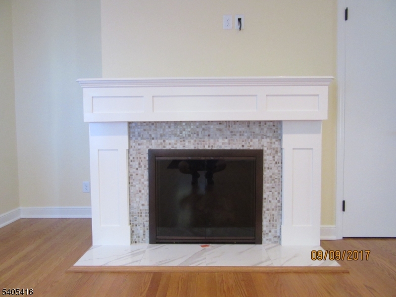 469 Bayberry Road Bridgewater, NJ 08807 - Photo 6 of 12 a living room with a fireplace