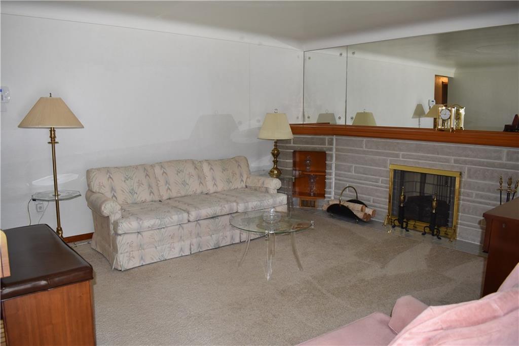 11705 McKee Road North Huntingdon, PA 15642 - Photo 8 of 22 Living room w/cove ceilings and neutral wall-to-wall.