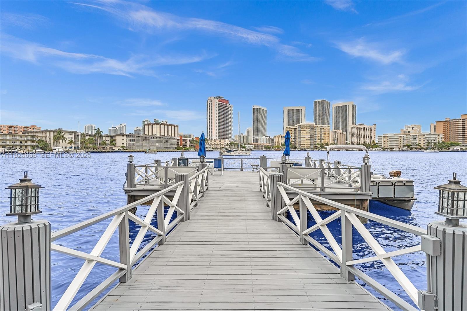 a view of a balcony with wooden floor and city view