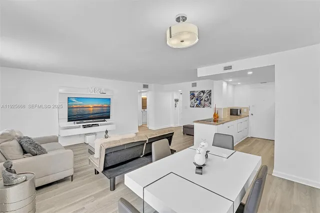 a kitchen with stainless steel appliances a refrigerator and a stove top oven