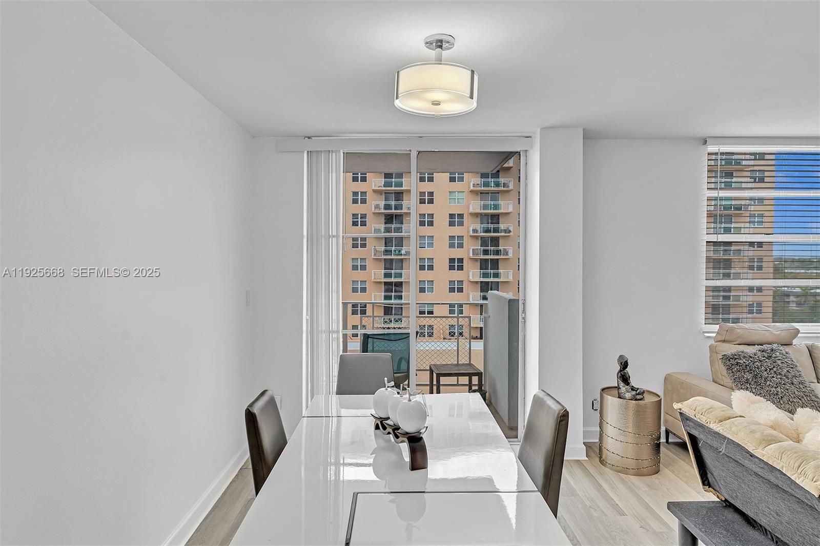 430 Golden Isles Drive, Unit 803 Hallandale Beach, FL 33009 - Photo 24 of 48 a view of a livingroom with furniture and window