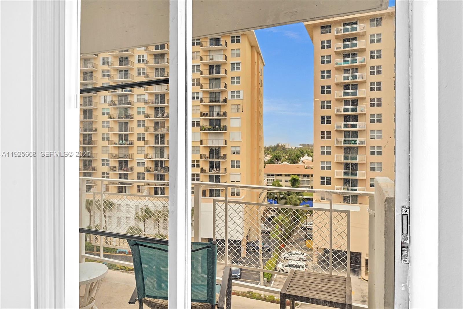 430 Golden Isles Drive, Unit 803 Hallandale Beach, FL 33009 - Photo 28 of 48 a view of balcony with wooden floor