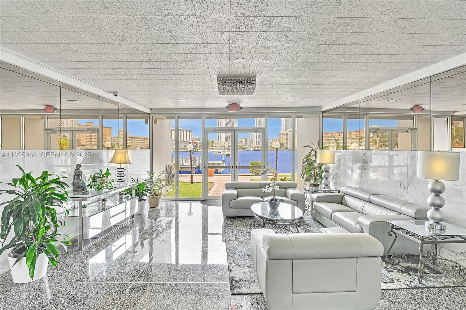 430 Golden Isles Drive, Unit 803 Hallandale Beach, FL 33009 - Photo 3 of 48 a very nice looking living room with a large window