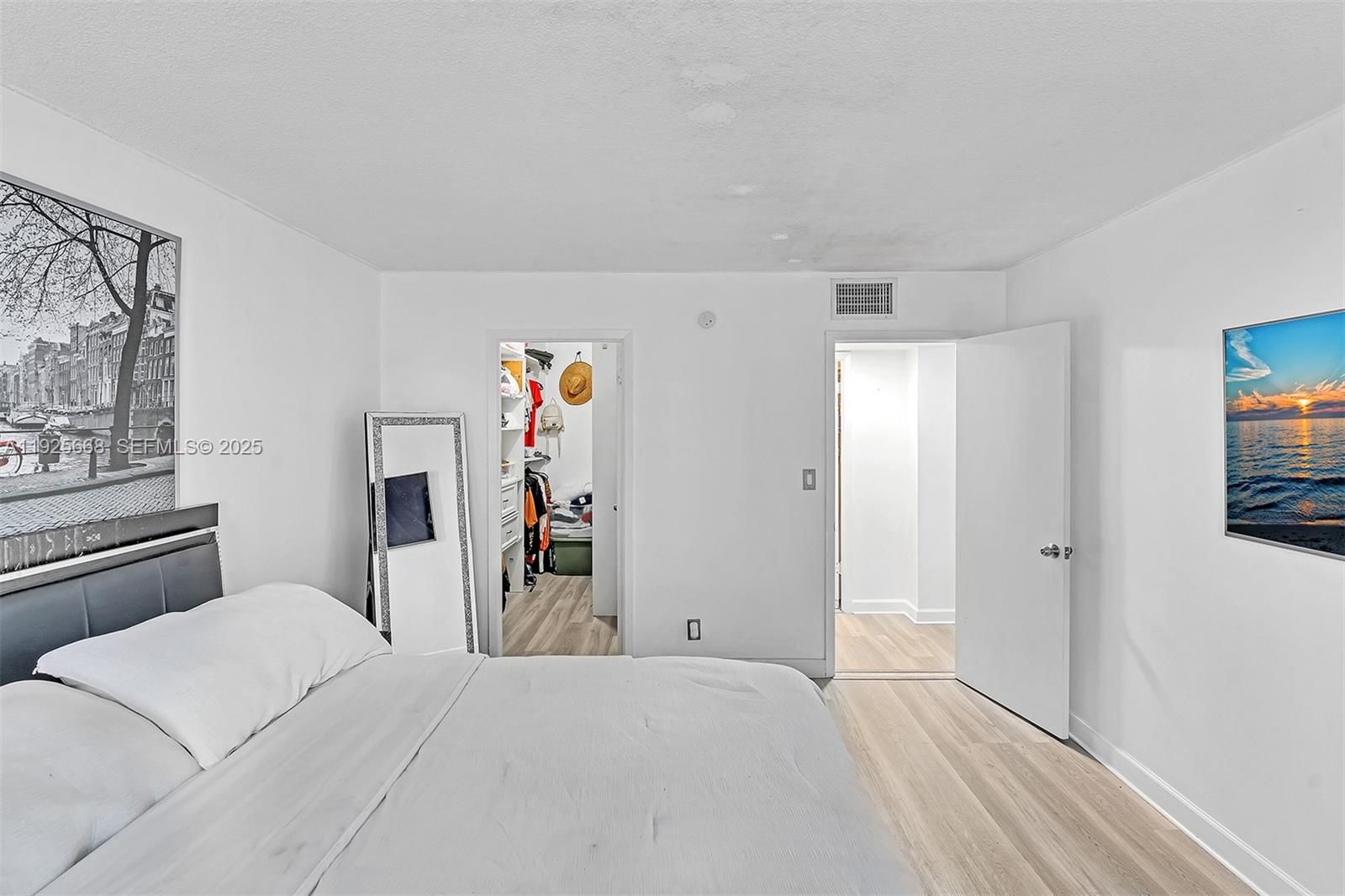 430 Golden Isles Drive, Unit 803 Hallandale Beach, FL 33009 - Photo 35 of 48 a bedroom with a bed and a window