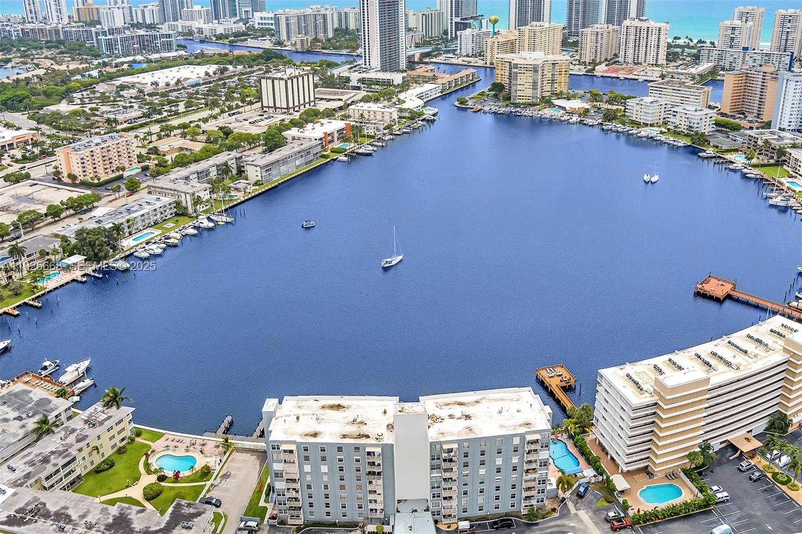 430 Golden Isles Drive, Unit 803 Hallandale Beach, FL 33009 - Photo 39 of 48 a view of a balcony with chairs