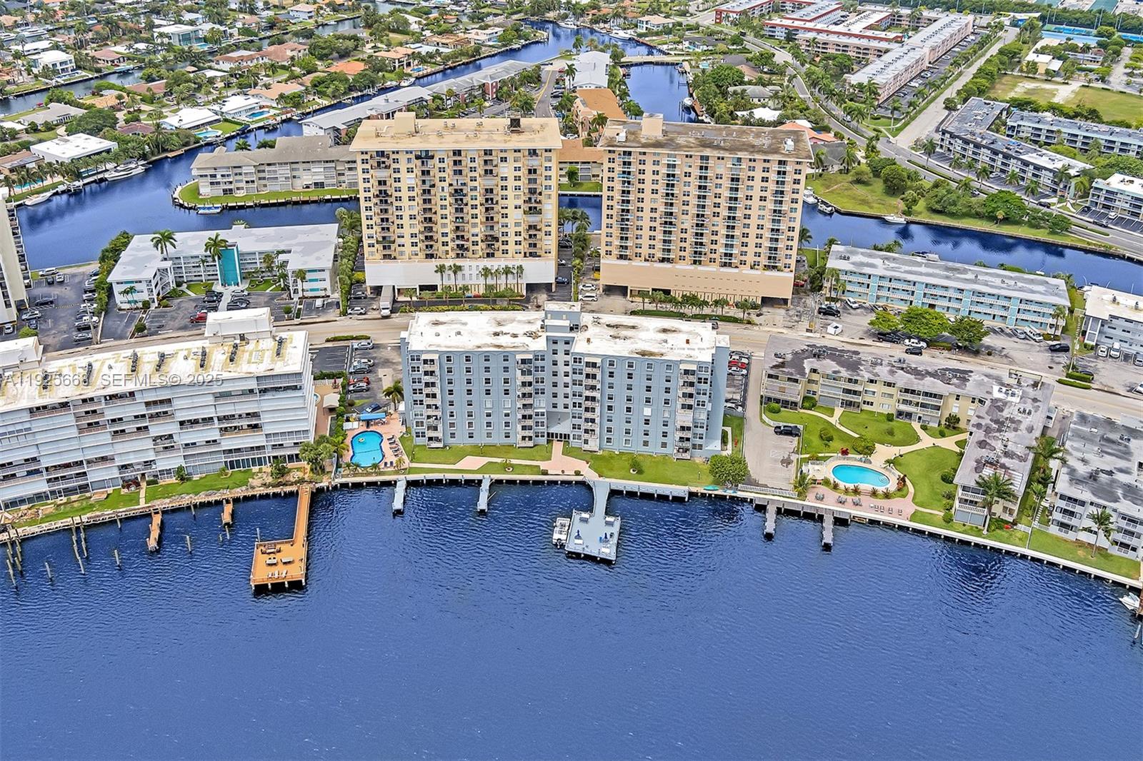 430 Golden Isles Drive, Unit 803 Hallandale Beach, FL 33009 - Photo 42 of 48 an aerial view of residential houses with outdoor space