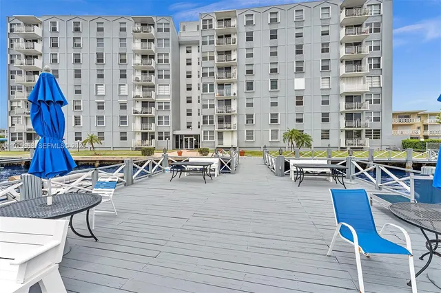 a view of a swimming pool with a chairs