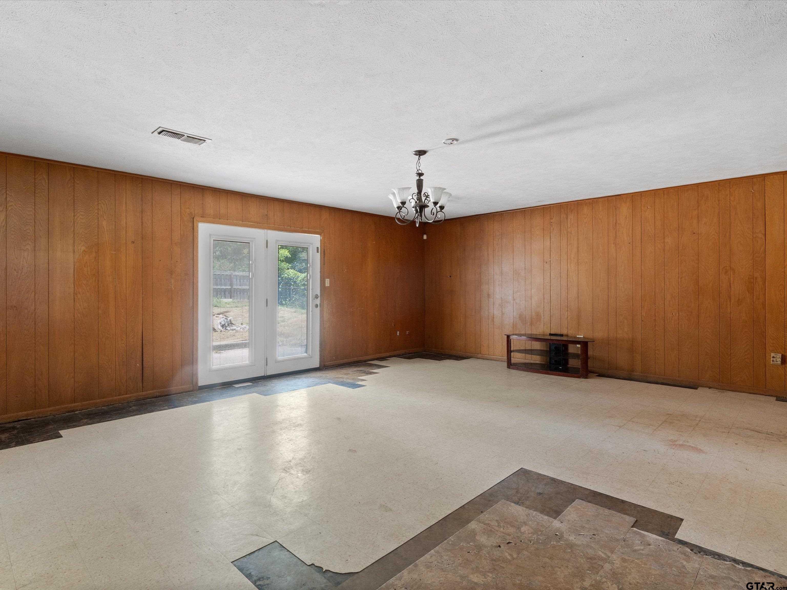 175 Stevens Street Gilmer, TX 75645 - Photo 11 of 25 a view of an empty room with a window