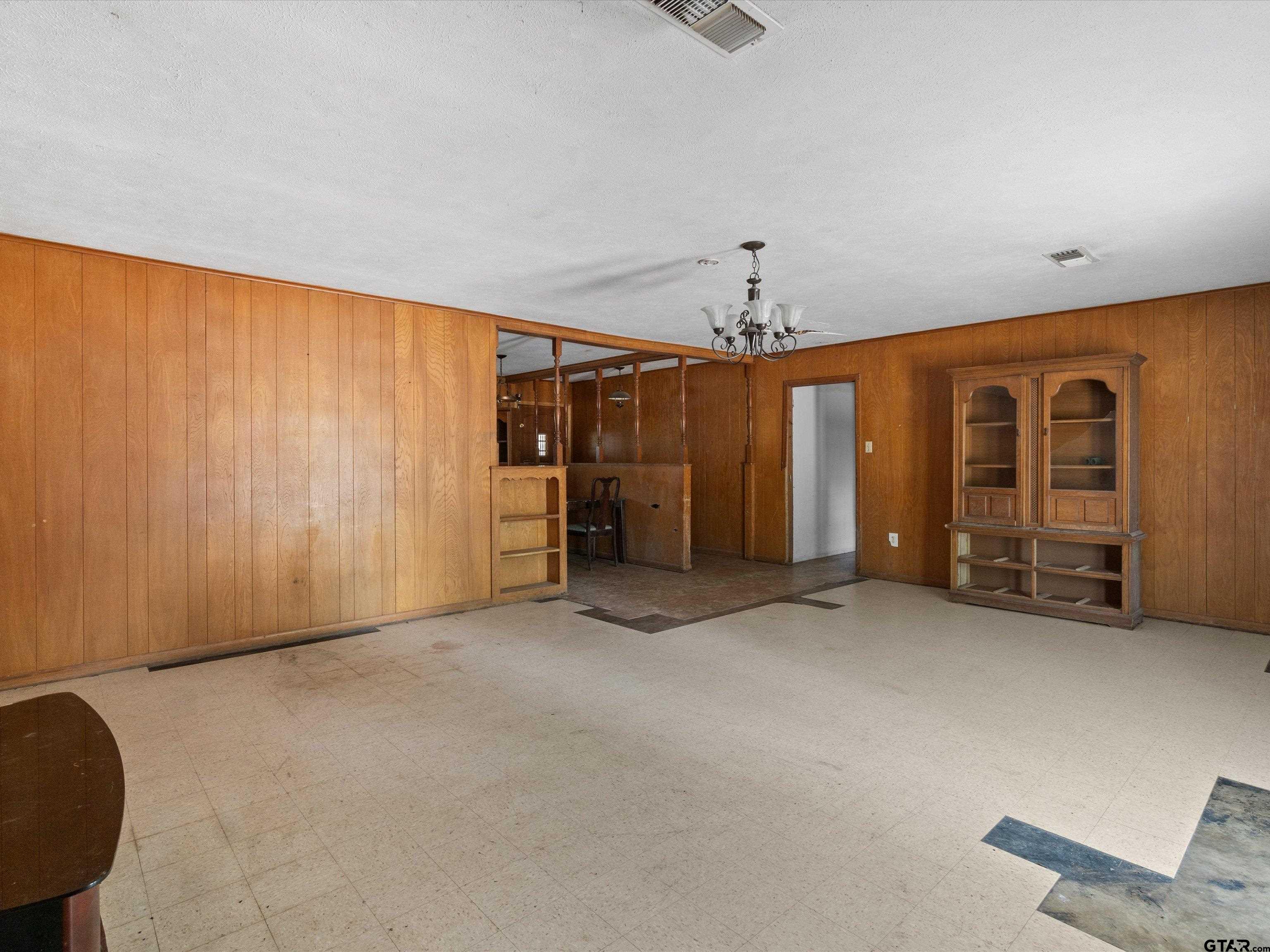 175 Stevens Street Gilmer, TX 75645 - Photo 12 of 25 an empty room with closet and windows