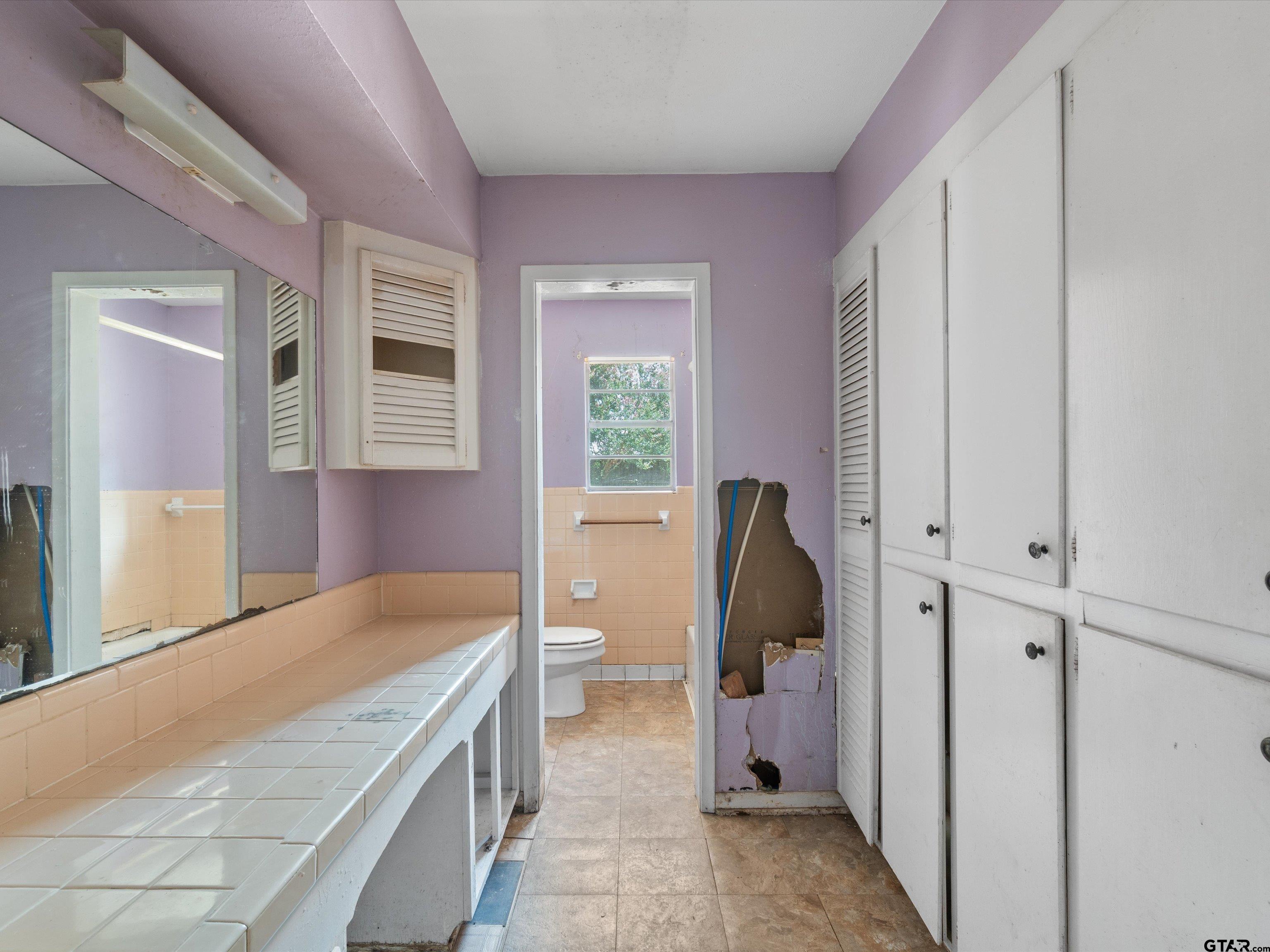 175 Stevens Street Gilmer, TX 75645 - Photo 18 of 25 a bedroom with a bed and a window