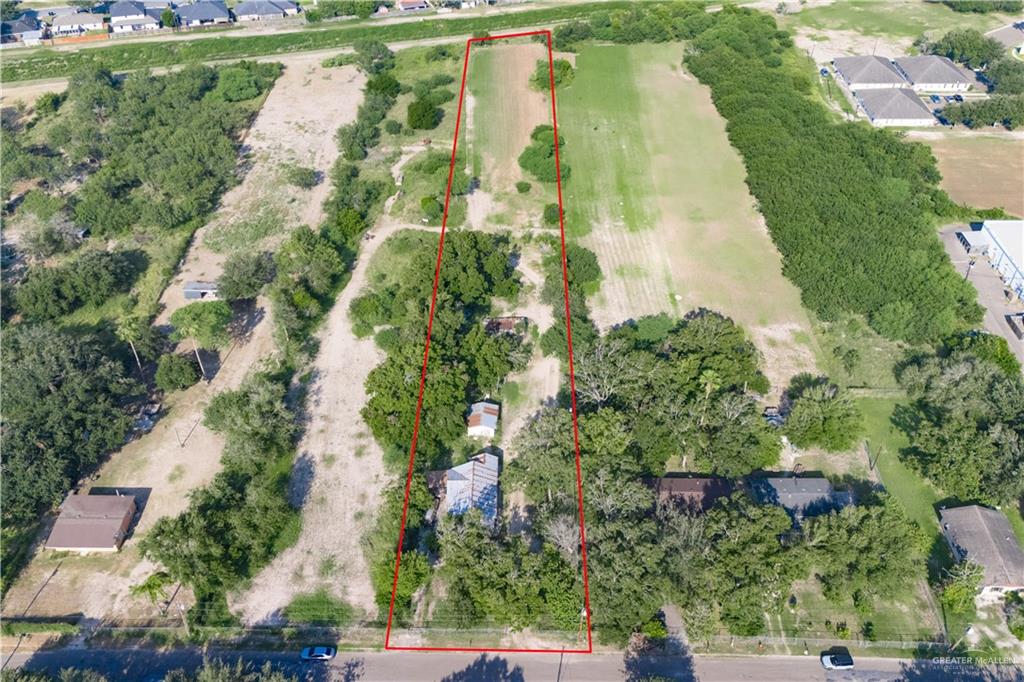 1222 South Tio Avenue Weslaco, TX 78596 - Photo 12 of 17 an aerial view of residential houses with outdoor space and trees all around