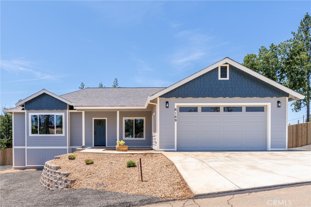 a front view of a house with yard