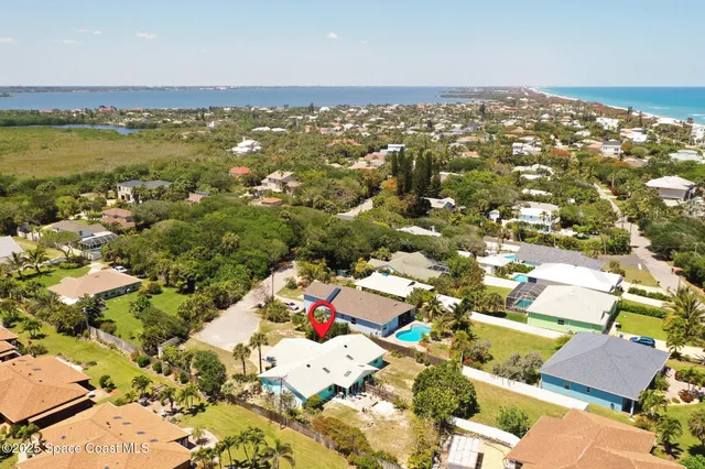 an aerial view of residential houses with outdoor space