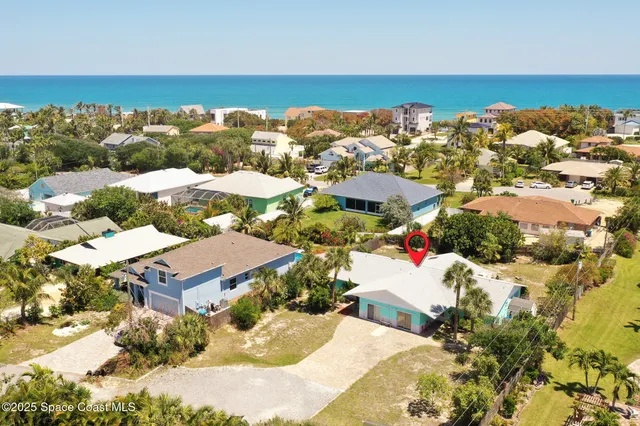 a aerial view of a house with a yard