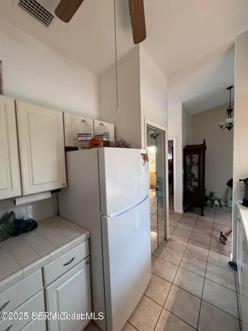 a hallway with a view of living room with furniture