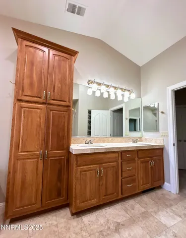 a kitchen with a refrigerator and sink