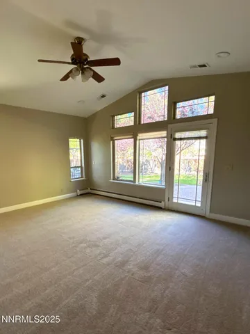 a view of an empty room with a window