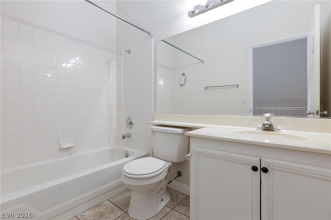 2246 Ramsgate Drive Henderson, NV 89074 - Photo 24 of 36 White subway tiles and a practical tub-shower combo complete this bright bathroom.