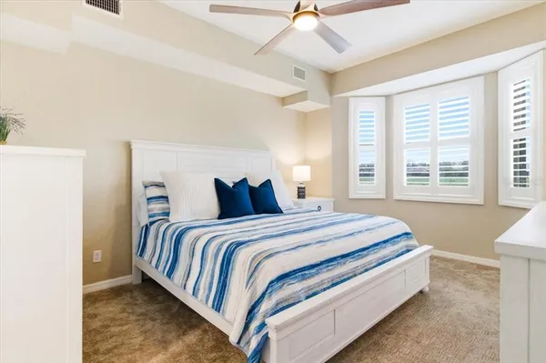 a bathroom with a sink a mirror and a shower
