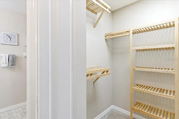 a front view of a house with a yard and plants