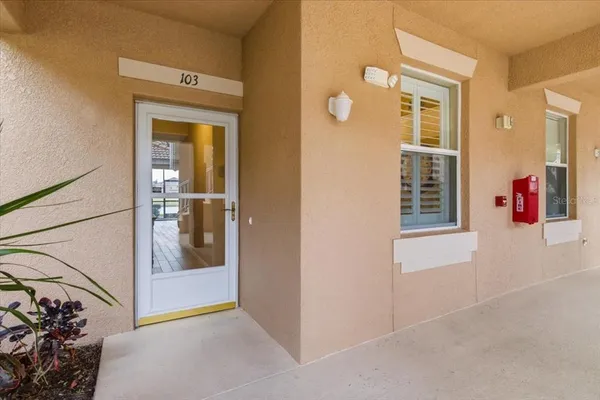 a kitchen with stainless steel appliances granite countertop a refrigerator and a stove