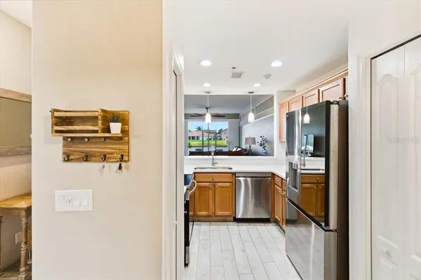 a kitchen with stainless steel appliances a sink stove and cabinets
