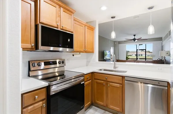a kitchen with a stove and a microwave