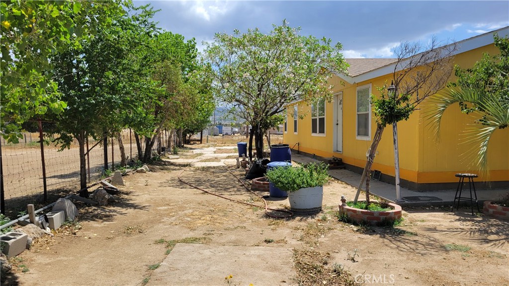 a view of a backyard with sitting area