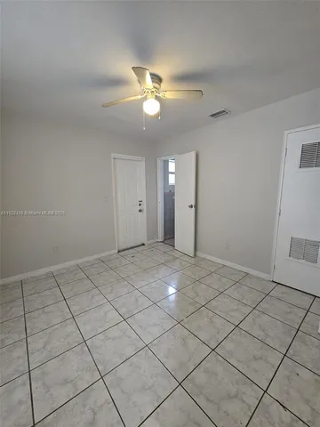 a view of an empty room and window