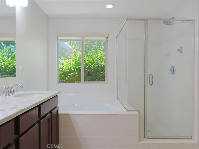 a white toilet sitting next to a shower