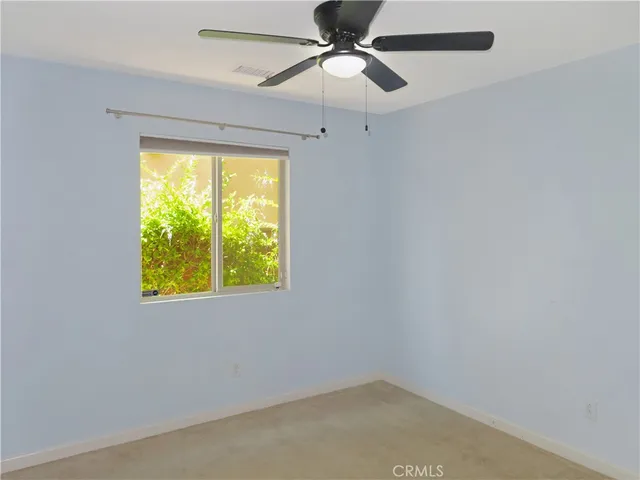 a bathroom with a granite countertop sink mirror and a bathtub