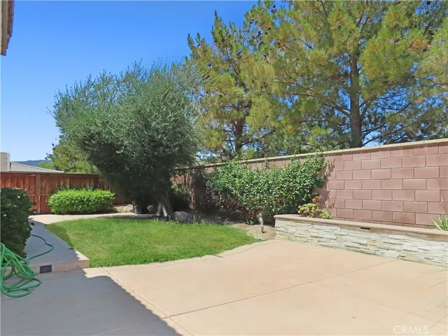 a view of a pathway with a backyard