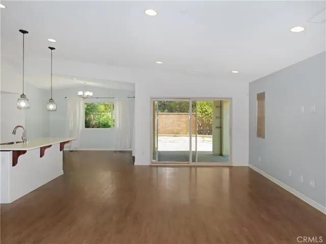 a view of a kitchen with a sink and a window