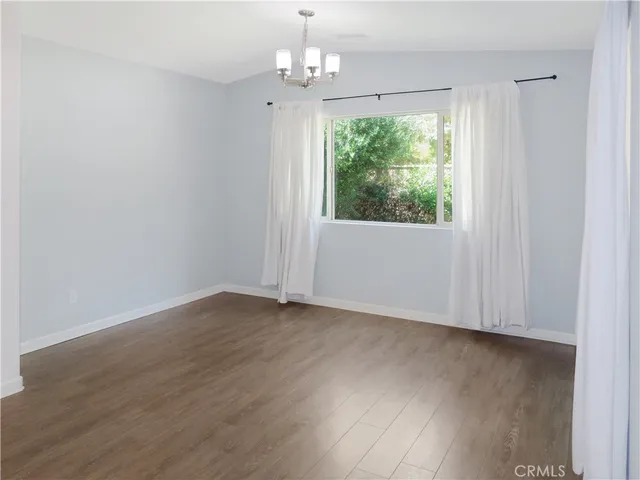 a view of kitchen with a sink stainless steel appliances and cabinets