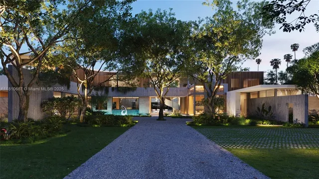 a front view of a house with a yard and tree s