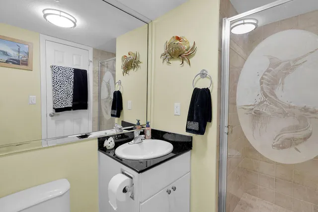 a bathroom with a sink vanity and mirror