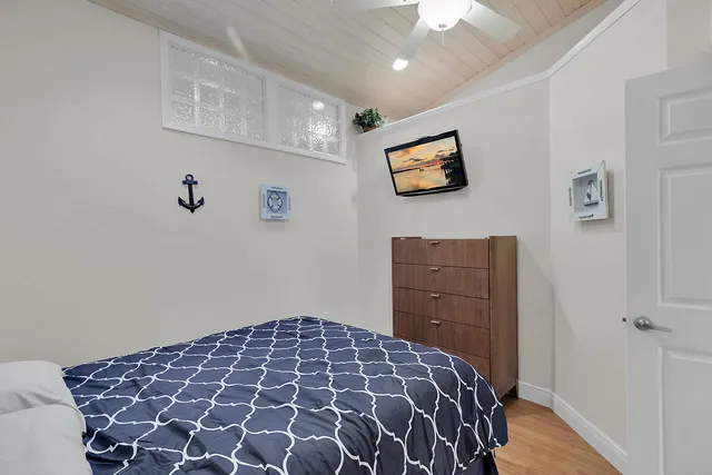 a bedroom with a bed and a cabinets