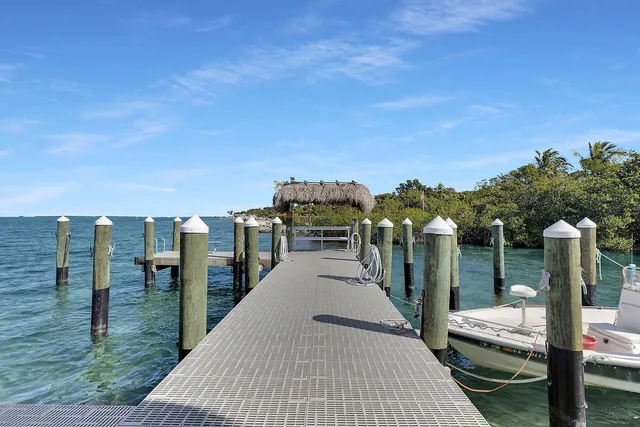 a view of a balcony with two chairs