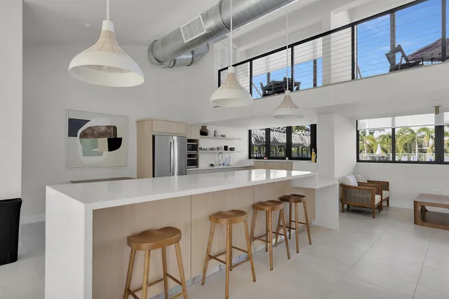 a kitchen with stainless steel appliances granite countertop a stove and cabinets
