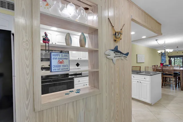 a kitchen with stainless steel appliances kitchen island a refrigerator and a stove