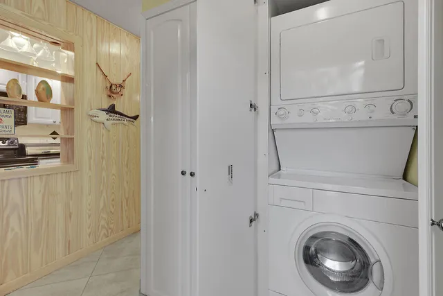 a view of a hallway with washer and dryer