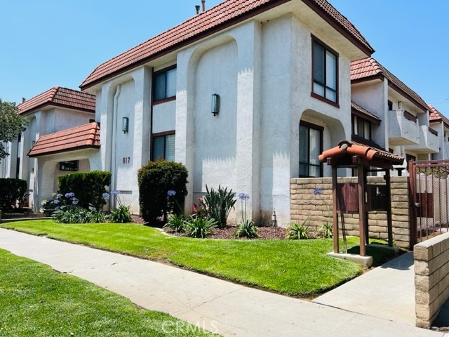 a front view of a house with garden